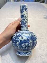 A Chinese blue and white bottle vase with floral design, hare mark, Wanli