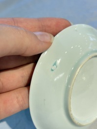 A pair of Chinese famille rose 'Taming the Tiger' saucers, Yongzheng