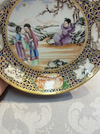 A Chinese famille rose gilt-decorated cup and saucer with figural design, Jiaqing