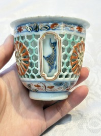 A rare Chinese famille verte reticulated double-walled cup and saucer, artemisia leaf mark, Kangxi