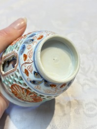 A rare Chinese famille verte reticulated double-walled cup and saucer, artemisia leaf mark, Kangxi
