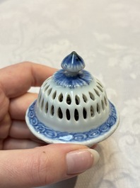 A rare Chinese blue and white reticulated double-walled ewer and cover with floral design, Kangxi