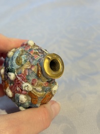 A Chinese famille rose moulded '18 Luohan' snuff bottle, Qianlong mark, 19th C.