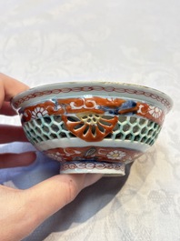 A rare Chinese famille verte reticulated double-walled cup and saucer, artemisia leaf mark, Kangxi