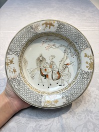 A fine Chinese grisaille, iron-red and gilt-decorated 'Riders on Horseback' plate, Yongzheng