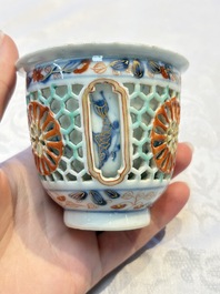A rare Chinese famille verte reticulated double-walled cup and saucer, artemisia leaf mark, Kangxi