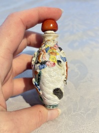 Four Chinese famille rose moulded 'Luohan' snuff bottles, Qianlong marks, 19th C.