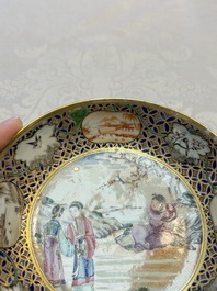 A Chinese famille rose gilt-decorated cup and saucer with figural design, Jiaqing