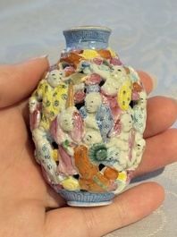 A Chinese famille rose moulded, reticulated and double-walled '18 Luohan' snuff bottle, Qianlong mark, 19th C.