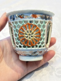 A rare Chinese famille verte reticulated double-walled cup and saucer, artemisia leaf mark, Kangxi
