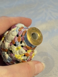 A Chinese famille rose moulded, reticulated and double-walled '18 Luohan' snuff bottle, Qianlong mark, 19th C.