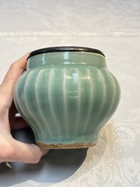 A Chinese Longquan celadon 'Lotus' jar with bronze mount, Song