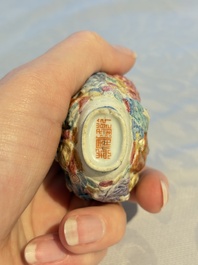 A Chinese famille rose moulded '18 Luohan' snuff bottle, Qianlong mark, 19th C.