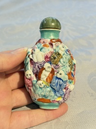 Four Chinese famille rose moulded 'Luohan' snuff bottles, Qianlong marks, 19th C.