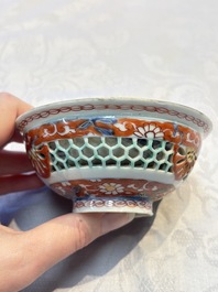 A rare Chinese famille verte reticulated double-walled cup and saucer, artemisia leaf mark, Kangxi