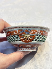 A rare Chinese famille verte reticulated double-walled cup and saucer, artemisia leaf mark, Kangxi