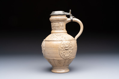 A Siegburg stoneware jug with mounted pewter lid, dated 1594