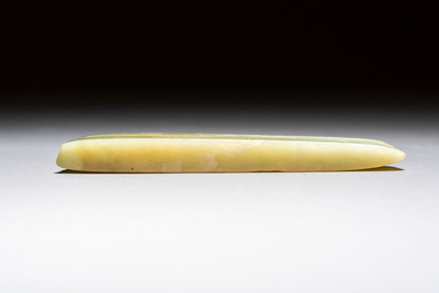 A Chinese celadon jade snuff bottle, a plaque and a ritual stick, Han and later