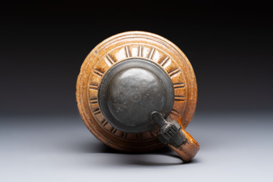 A Raeren stoneware 'Peasants Dance' jug with a mounted pewter lid, dated 1587