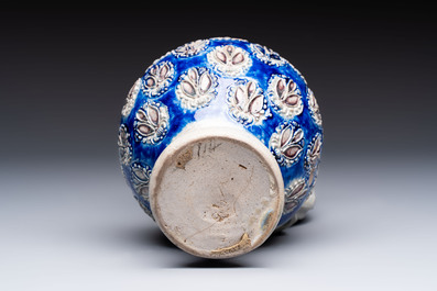 A Westerwald stoneware jug with a lion's head and moulded floral design, Germany, 17th C.