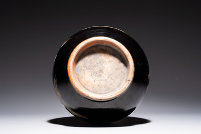 A Chinese black-glazed reverse-decorated bottle vase, 20th C.