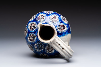 A Westerwald stoneware jug with a lion's head and moulded floral design, Germany, 17th C.