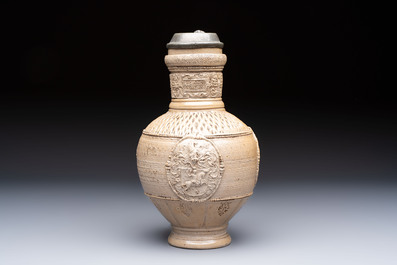 A Siegburg stoneware jug with mounted pewter lid, dated 1594