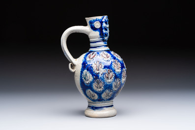 A Westerwald stoneware jug with a lion's head and moulded floral design, Germany, 17th C.