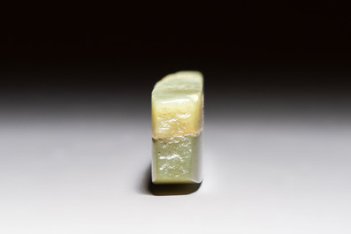 A Chinese celadon jade snuff bottle, a plaque and a ritual stick, Han and later