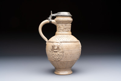 A Siegburg stoneware jug with mounted pewter lid, dated 1594