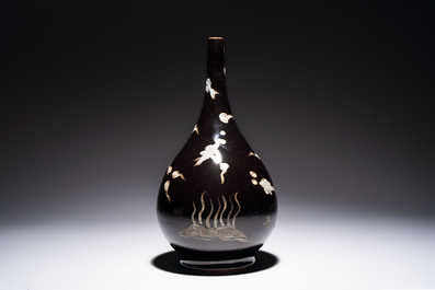 A Chinese black-glazed reverse-decorated bottle vase, 20th C.