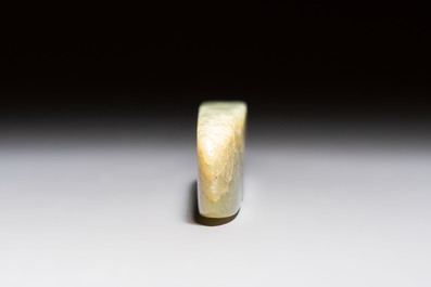 A Chinese celadon jade snuff bottle, a plaque and a ritual stick, Han and later