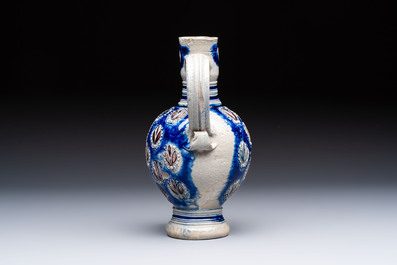 A Westerwald stoneware jug with a lion's head and moulded floral design, Germany, 17th C.