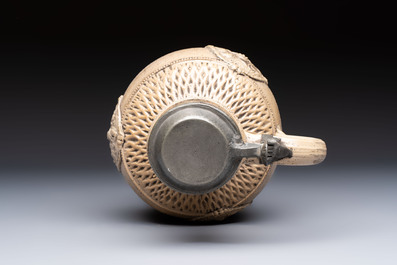 A Siegburg stoneware jug with mounted pewter lid, dated 1594
