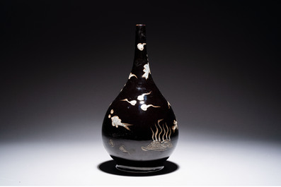 A Chinese black-glazed reverse-decorated bottle vase, 20th C.