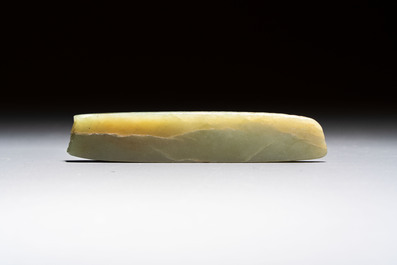 A Chinese celadon jade snuff bottle, a plaque and a ritual stick, Han and later