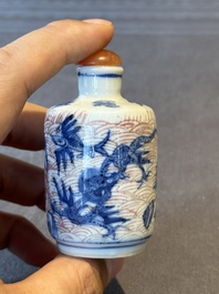 Two Chinese blue, white and copper-red 'Mythical Animals' snuff bottles, Qianlong mark and of the period
