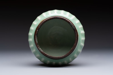 A Chinese Longquan celadon 'Lotus' jar with bronze mount, Song