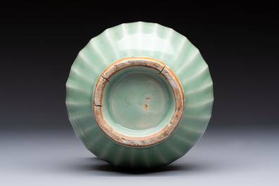 A Chinese Longquan celadon 'Lotus' jar with bronze mount, Song