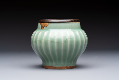 A Chinese Longquan celadon 'Lotus' jar with bronze mount, Song
