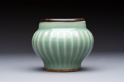 A Chinese Longquan celadon 'Lotus' jar with bronze mount, Song