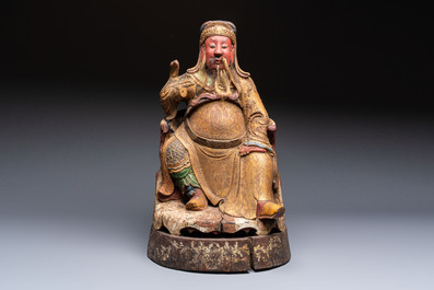 A large Chinese gilt-lacquered and polychrome wooden figure of Guandi, 19th C.