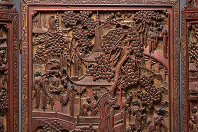 A Chinese carved gilt-lacquered wooden three-panel folding screen with a narrative design, 19/20th C.