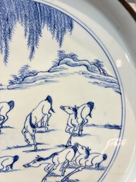 A rare Chinese silver-mounted blue and white 'Eight Horses of Mu Wang' dish, Kangxi