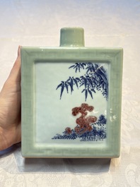 A Chinese blue, white and copper-red celadon-ground tea caddy with floral and bamboo design, Qianlong mark and of the period