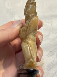 A Chinese carved mother-of-pearl figure of an official on wooden stand, 18/19th C.