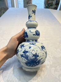 A Chinese blue and white double gourd 'Antiquities' vase, Kangxi