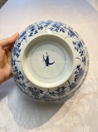 A Chinese blue and white bowl with floral design and a famille verte bowl, Kangxi