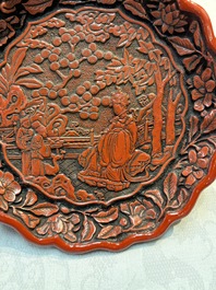 A fine Chinese red cinnabar lacquer flower-shaped 'Xi Wang Mu 西王母' dish, Ming