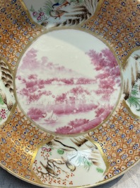A Chinese famille rose puce-enamelled 'Riverscape' plate, cup and saucer, Jiaqing
